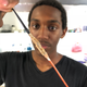 Louis Anderson, Jr. showing of the biocompatible coating he created for implants. The coating, shown in the middle of a long LED light, wound up not being implanted as planned over the weekend, because it did not appear safe enough.